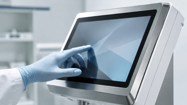Sealed cleanable medical touch display with gloved interaction